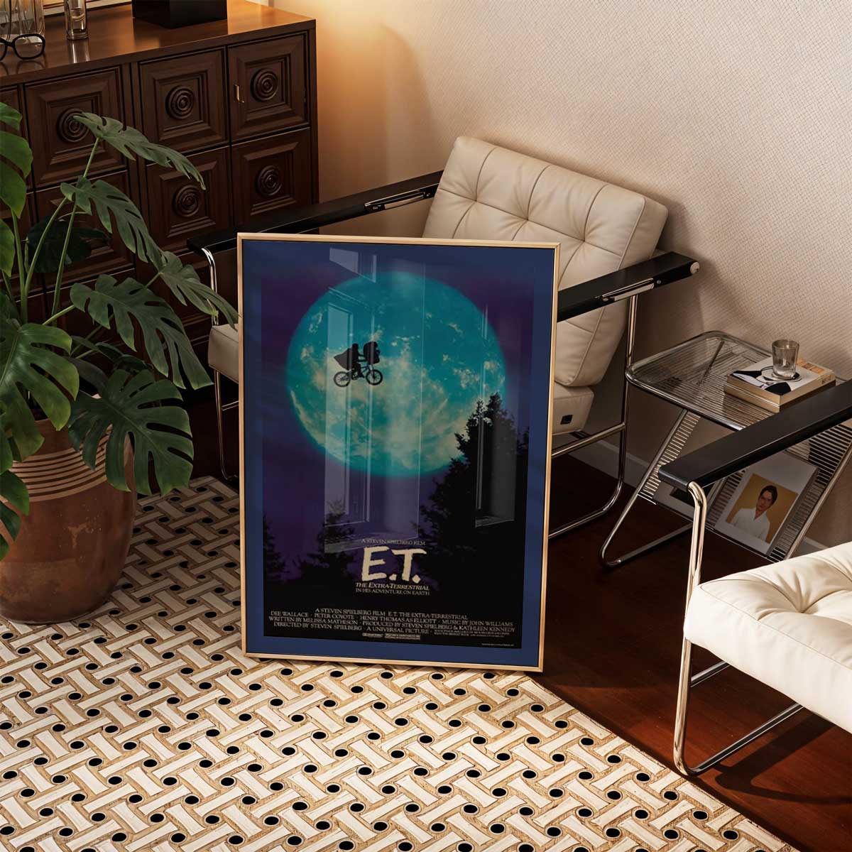 E.T. movie poster shown framed on a wall